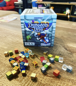 Dungeon Drop Box Art with Cubes scattered in front 