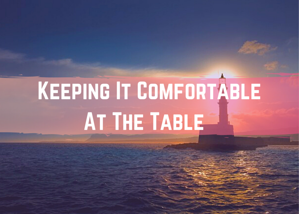 Text reads keeping it comefortable at the table over a calm ocean with a lighthouse on the right side