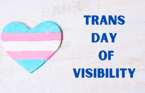 Text reads Trans Day of Visibility next to a heart decorated with the trans pride flag