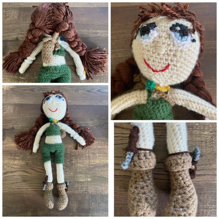 A crocheted humanoid form