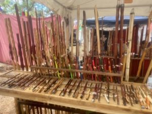 display of wooden walking sticks and magic wands