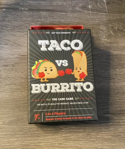 Taco Vs Burrito Box Art Featuring a taco and burrito with boxing gloves 