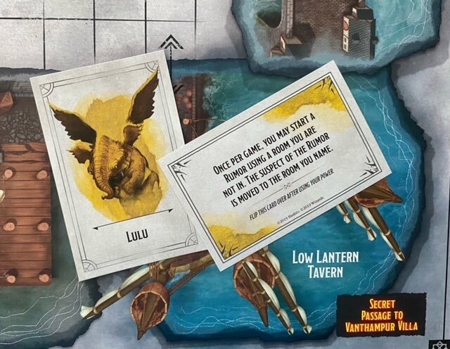 Pictured: Lulu Character Card and Lulu Special Ability Card, placed upon a part of the D&D Clue game board.