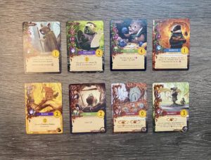 Eight Everdell cards, four critter and four location cards