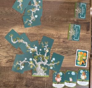 Kodama tree cards laid our with objective cards in bottom right