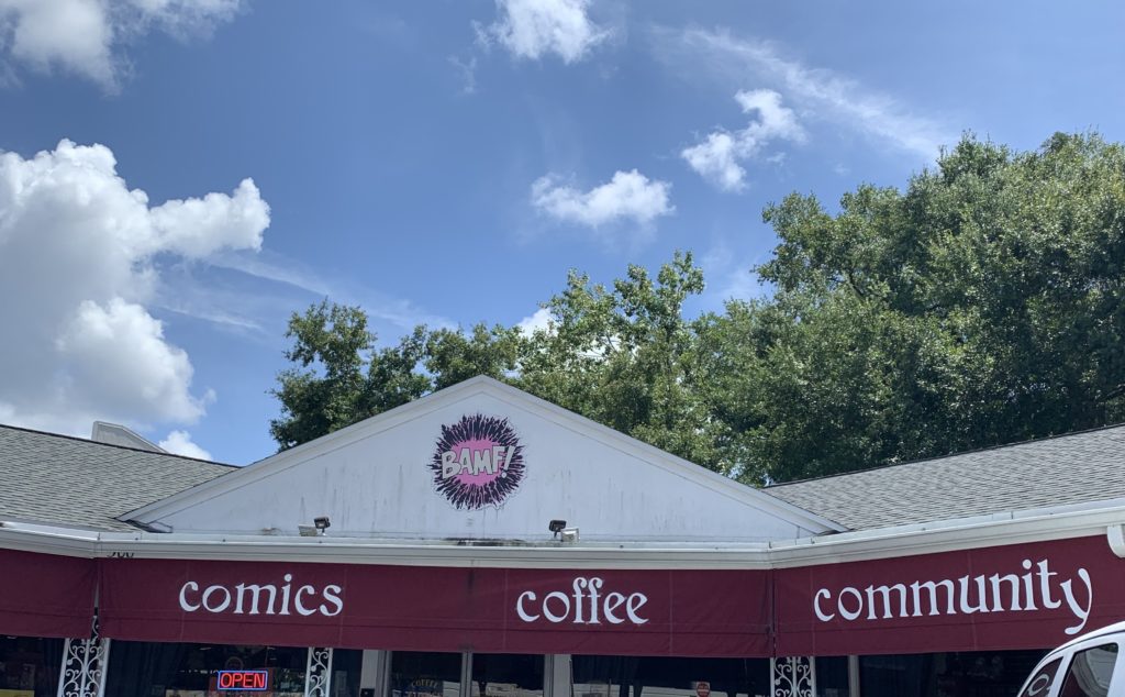 The BAMF Comics & Coffeehouse Storefront, a red and white building with the BAMF Logo, and the words "comics" and "coffee" written in white.